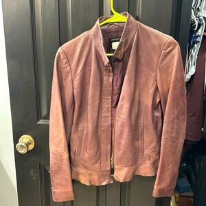 Genuine leather jacket with silk lining.